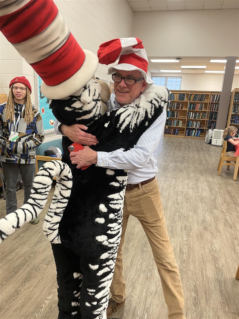 ASB Principal Alan Nunn receives a big hug from the Cat.  